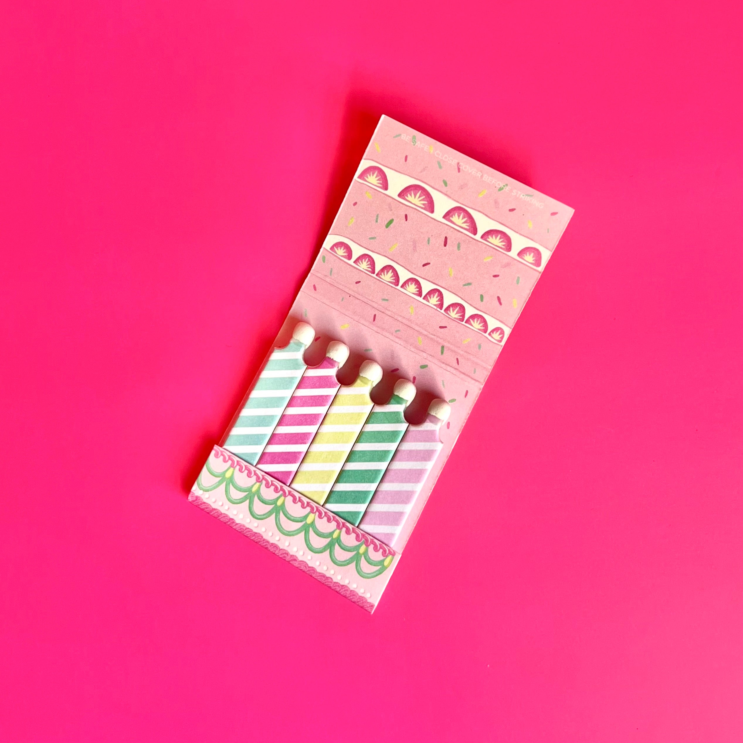 Inside of happy birthday matchbook showing birthday candles as the matchsticks