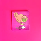 Front of cat matchbook featuring an orange cat with fish bones on the bottom 