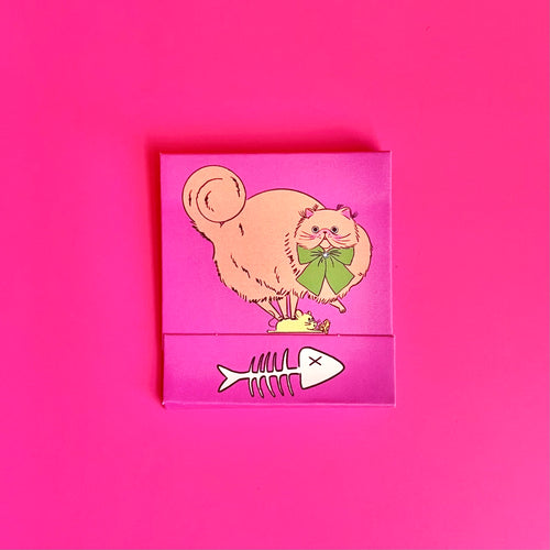 Front of cat matchbook featuring an orange cat with fish bones on the bottom 