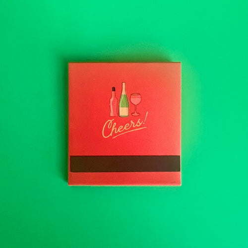 Back of the Aperol Spritz cocktail matchbook featuring a drawing of the bottles needed to make it with the match-striking bar at the bottom 