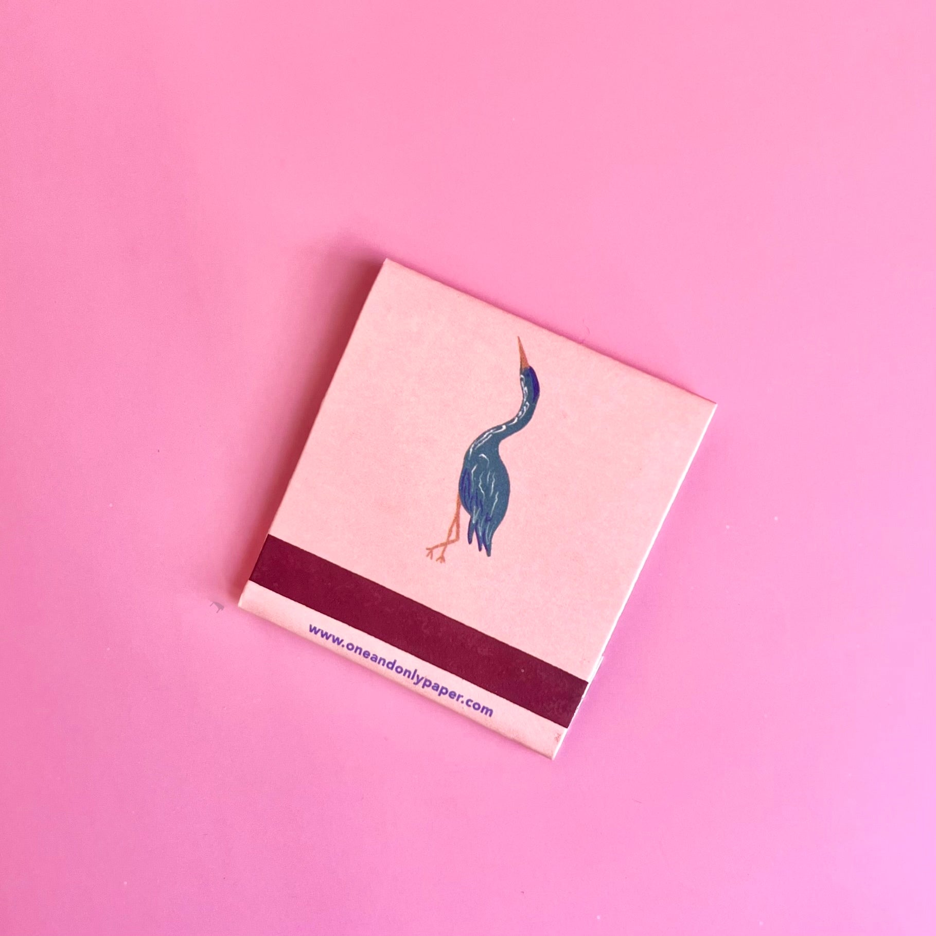 Back of exotic birds matchbook depicting a bird with the match-striking bar on the bottom 